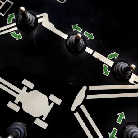 Close-up of knobs and a machine diagram.