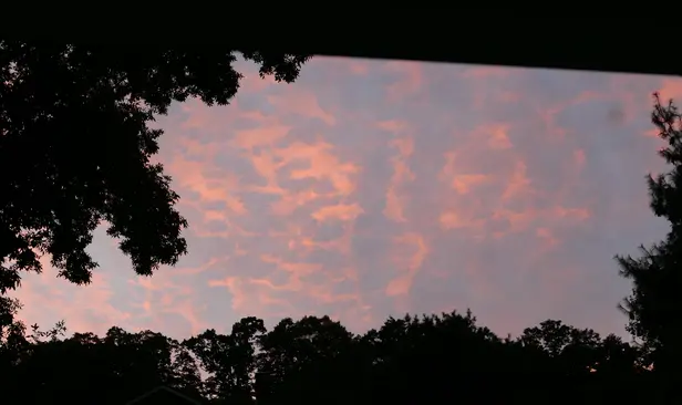 A pinkish orange and light blue sky.